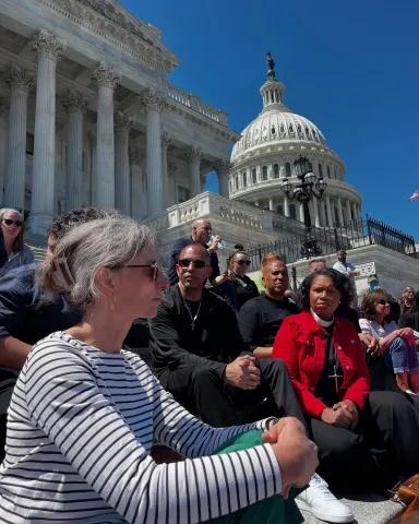 Rep. Dexter sitting on the steps of the Capitol